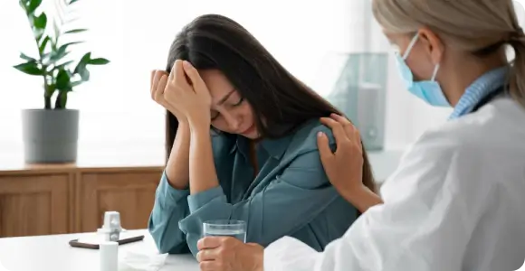 A healthcare professional providing regenerative-based mental health support for a patient experiencing anxiety, neurological stress, and chronic mood challenges.