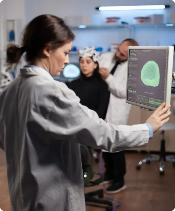 Dr. Magnano consulting a patient on changing their cellular environment to halt the progression of neurodegenerative disease.